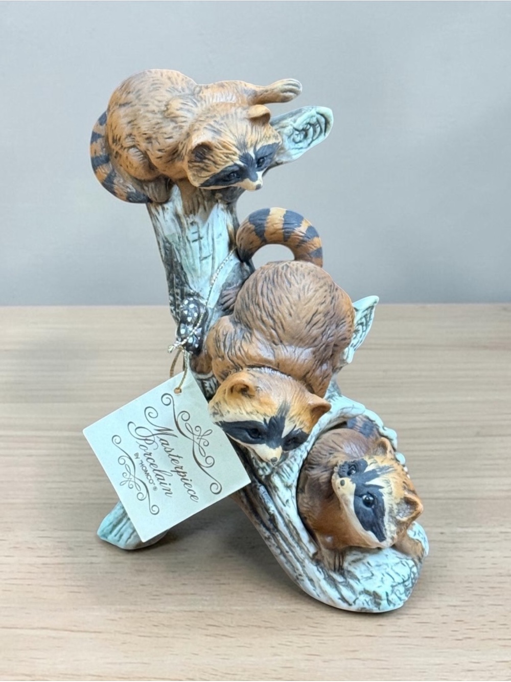 HOMCO Masterpiece Porcelain Raccoons on Tree Figurine